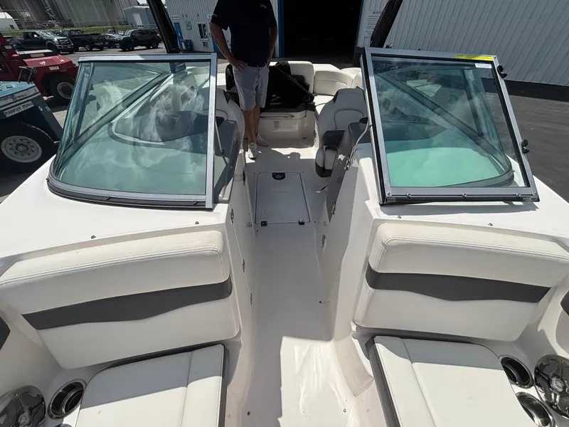 Slide: The Image of 2013 Chaparral 246 SXI boat interior with open windshield and seating. - 11