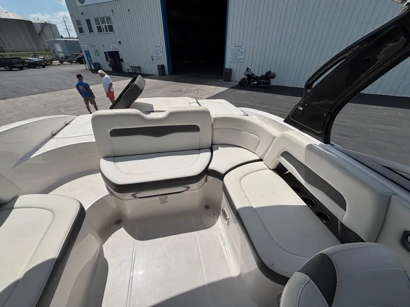 Slide: The Image of Interior view of 2013 Chaparral 246 SXI boat with white seating and open deck. - 13