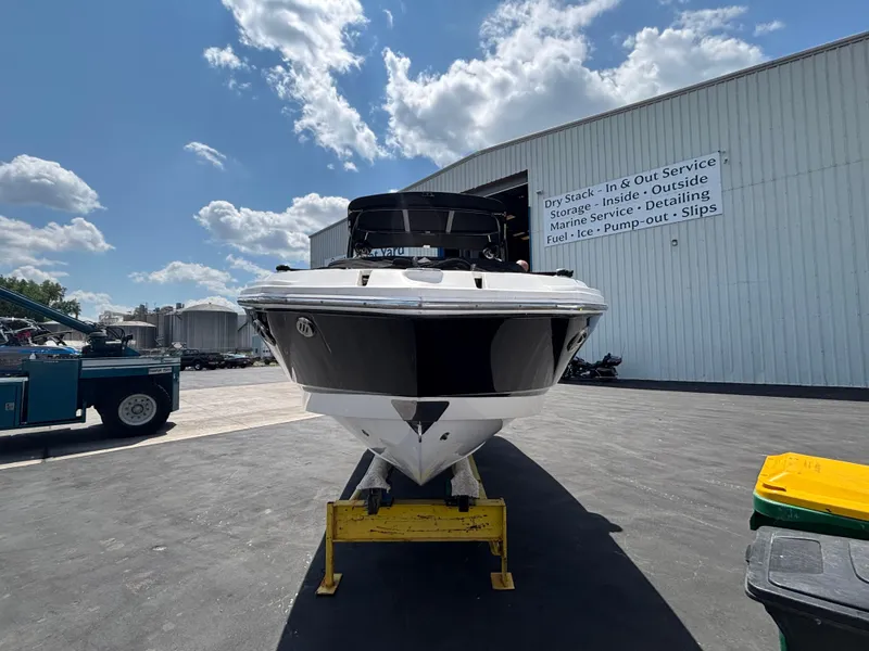 Slide: The Image of Chaparral 246 SXI 2013 boat on stand, outdoor service area, clear sky. - 3