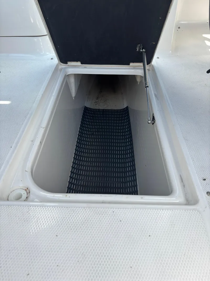 Slide: The Image of Open storage compartment on 2013 Chaparral 246 SXI boat deck. - 16