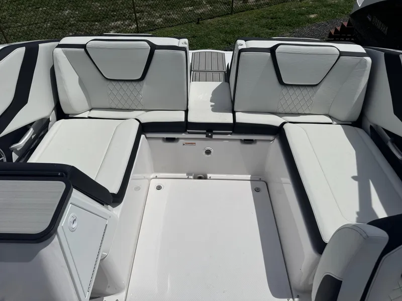 Slide: The Image of 2025 Yamaha Boats 252S interior with white cushioned seating and modern design. - 13