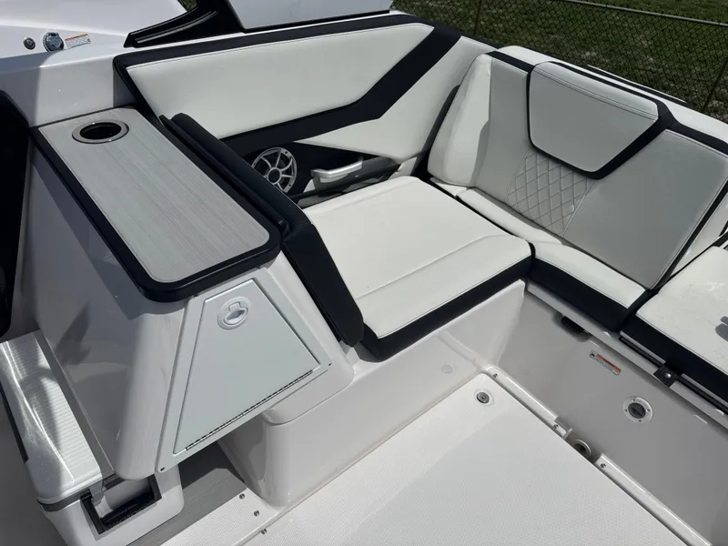 Slide: The Image of 2025 Yamaha Boats 252S interior with sleek white seating and modern design. - 14