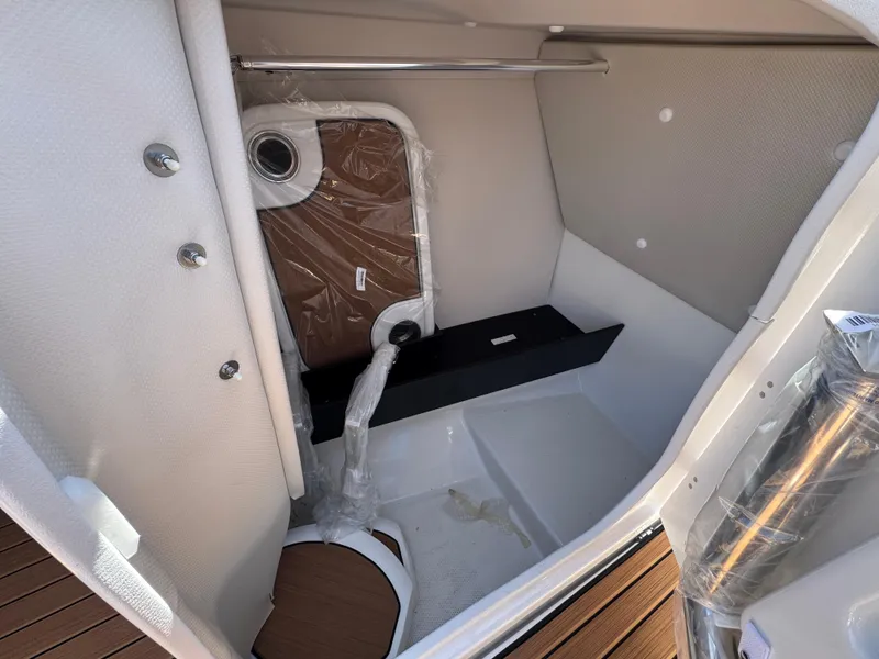 Slide: The Image of 2025 Yamaha Boats 252S interior cabin with modern design and storage space. - 12
