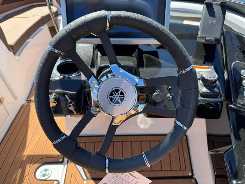 Slide: The Image of Steering wheel of 2025 Yamaha Boats 252S, featuring sleek design and modern controls. - 21