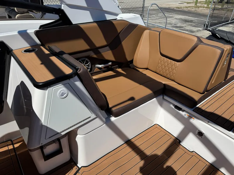 Slide: The Image of 2025 Yamaha Boats 252S interior with brown leather seating and modern design. - 34