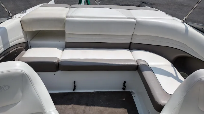 Slide: The Image of Interior seating of a 1999 Cobalt 226 boat with cup holders. - 10