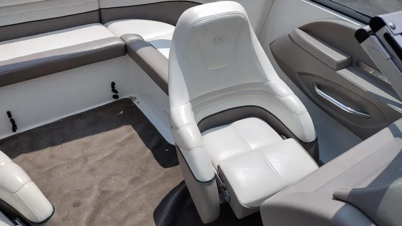 Slide: The Image of Interior seating of a 1999 Cobalt 226 boat with white and gray upholstery. - 12