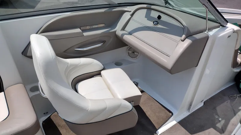 Slide: The Image of Interior of a 1999 Cobalt 226 boat featuring plush seating and sleek design. - 17