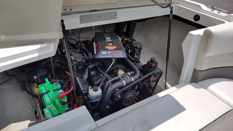 Slide: The Image of Interior of a 1999 Cobalt 226 boat with white and gray seating. - 21