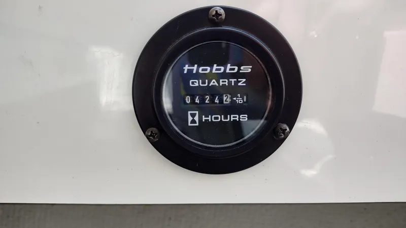 Slide: The Image of 1999 Cobalt 226 boat interior with white and gray seating arrangement. - 22