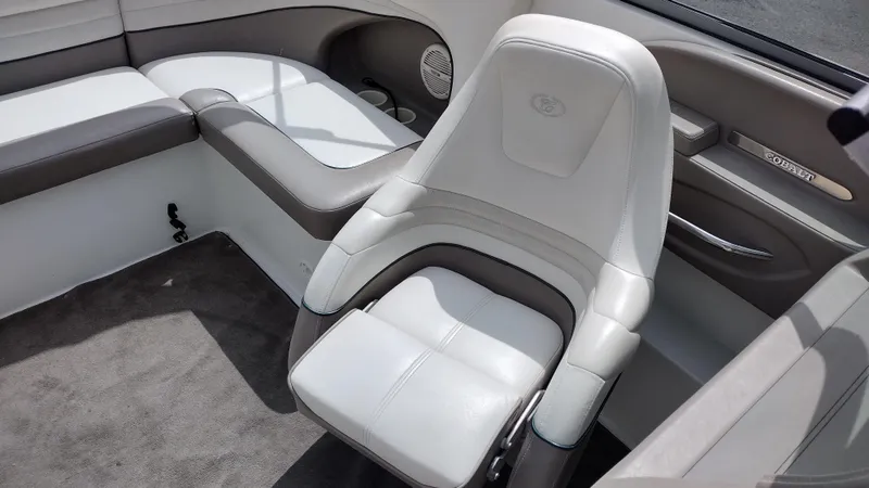 Slide: The Image of Interior of a 1999 Cobalt 226 boat with seating and steering wheel. - 28