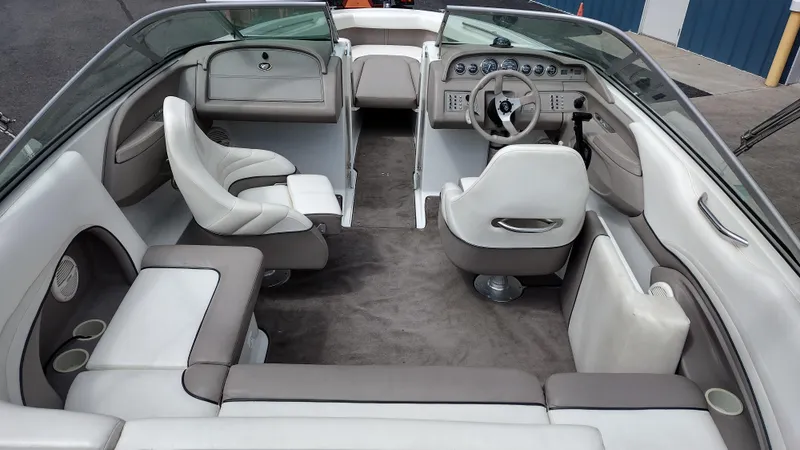 Slide: The Image of Interior of a 1999 Cobalt 226 boat with seating and steering wheel. - 8