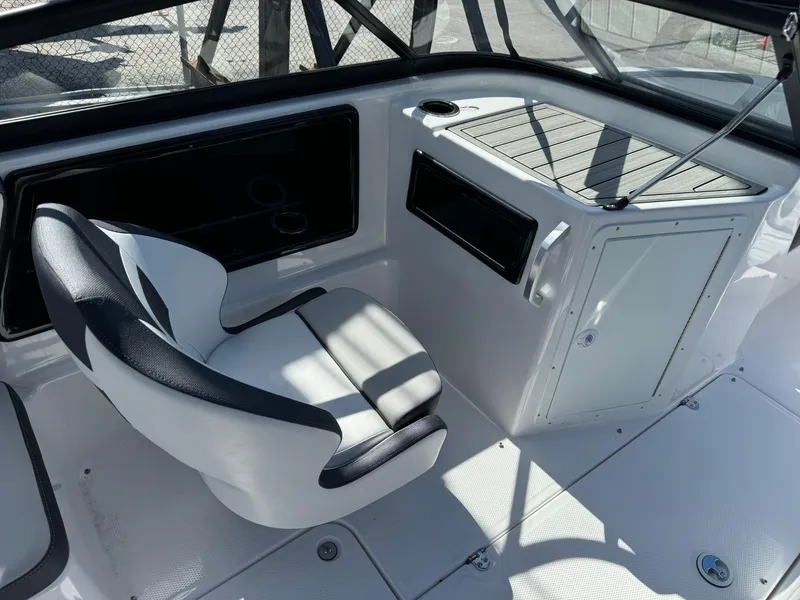 Slide: The Image of 2025 Yamaha Boats SX190 interior with sleek seating and modern dashboard design. - 16