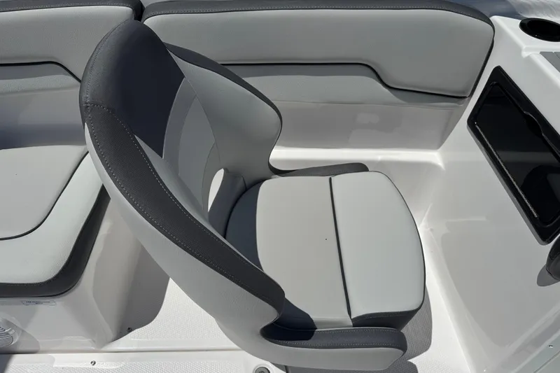 Slide: The Image of 2025 Yamaha Boats SX190 interior seat with gray upholstery and sleek design. - 11