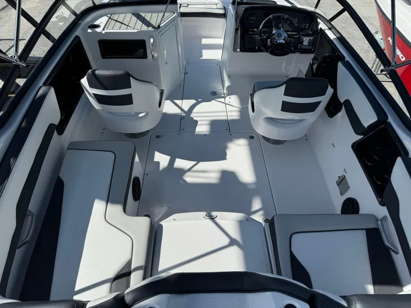 Slide: The Image of 2025 Yamaha Boats SX190 interior with modern seating and steering console. - 28