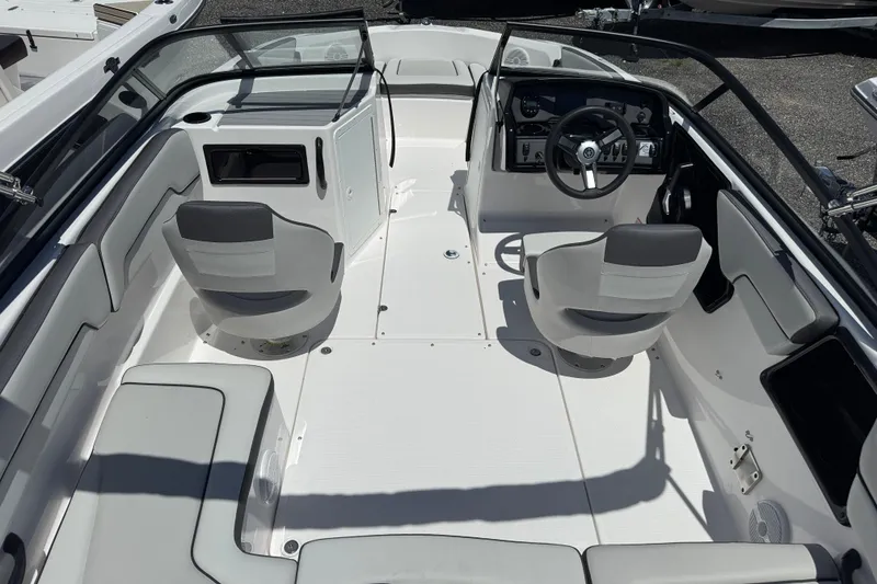 Slide: The Image of 2025 Yamaha Boats SX190 interior with dual swivel seats and modern dashboard. - 4
