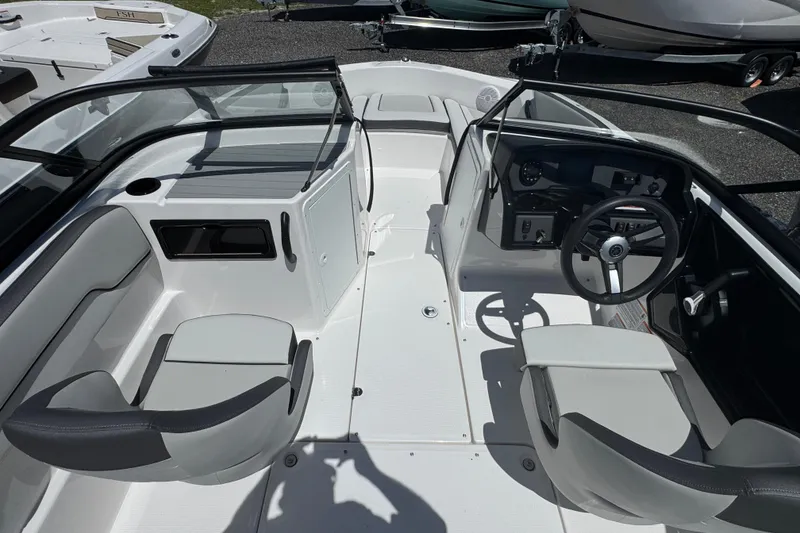 Slide: The Image of 2025 Yamaha Boats SX190 interior with dual seating and modern dashboard design. - 5
