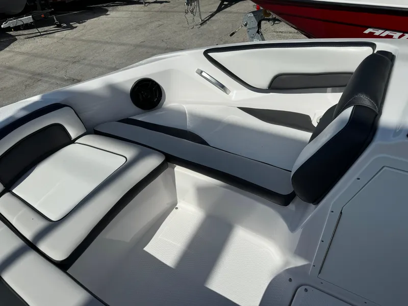 Slide: The Image of 2025 Yamaha Boats SX190 interior with sleek white and black seating. - 33