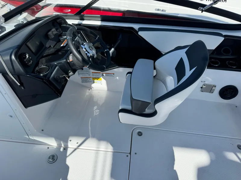 Slide: The Image of 2025 Yamaha Boats SX190 cockpit with steering wheel and captain's seat, featuring modern design. - 41