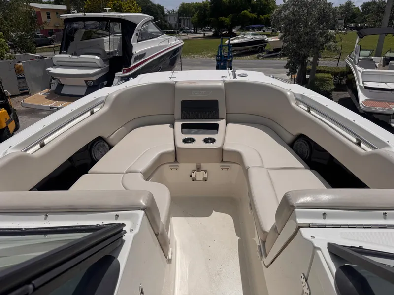 Slide: The Image of 2014 Boston Whaler 270 Vantage boat interior with spacious seating and cup holders. - 14