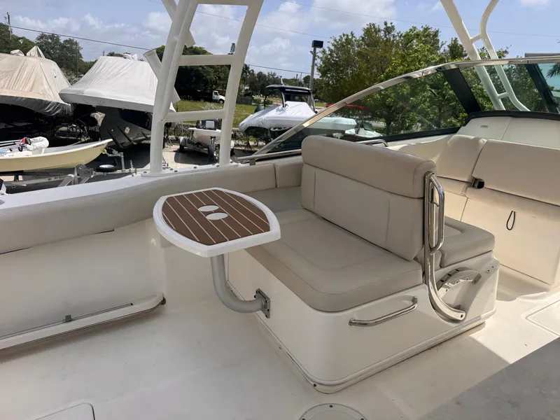 Slide: The Image of 2014 Boston Whaler 270 Vantage boat interior with seating and table. - 5