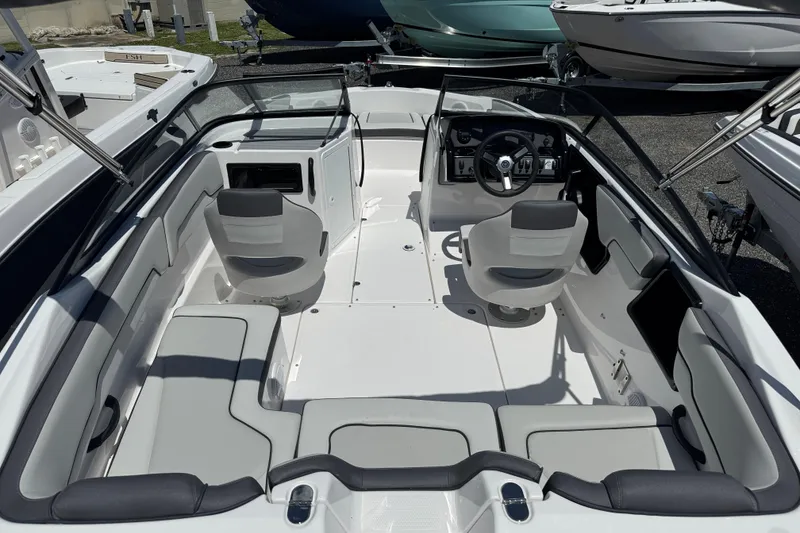 Slide: The Image of 2025 Yamaha Boats SX190 interior with modern seating and steering console. - 3