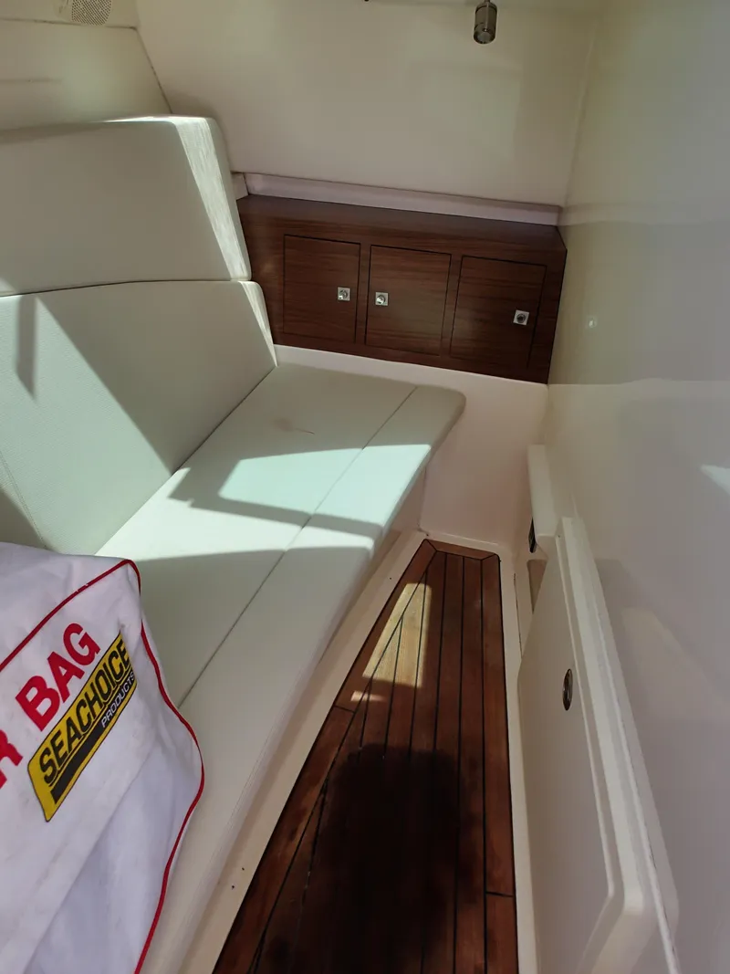 Slide: The Image of Interior of 2017 Boston Whaler 320 Vantage with seating and storage. - 10