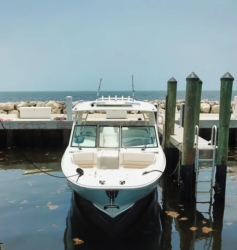 Slide: The Image of 2017 Boston Whaler 320 Vantage docked by the sea. - 17