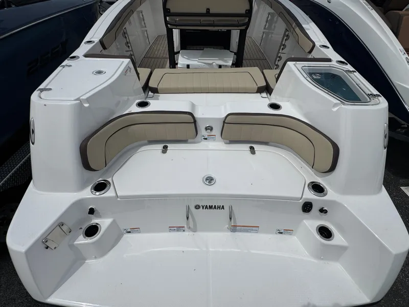 Slide: The Image of 2025 Yamaha Boats 255 FSH Sport H, featuring spacious seating and modern design. - 2