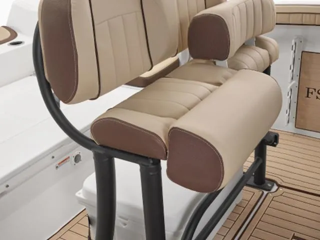 Slide: The Image of 2025 Yamaha Boats 255 FSH Sport H seating with tan and brown upholstery. - 31
