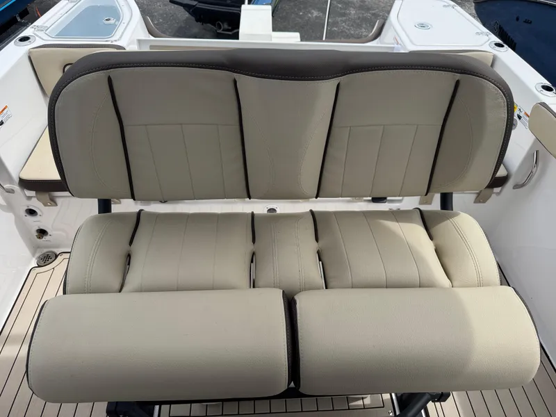 Slide: The Image of 2025 Yamaha Boats 255 FSH Sport H, beige cushioned seating detail. - 4