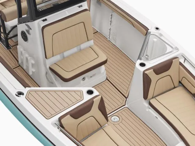 Slide: The Image of 2025 Yamaha Boats 255 FSH Sport H interior with tan seating and sleek design. - 8