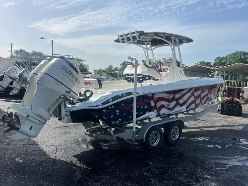 Slide: The Image of 2019 Glasstream 280 Pro-XS boat with American flag design, on trailer, Suzuki engine. - 4