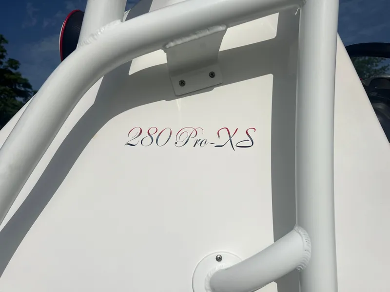 Slide: The Image of 2019 Glasstream 280 Pro-XS boat detail with white railing and model name. - 6