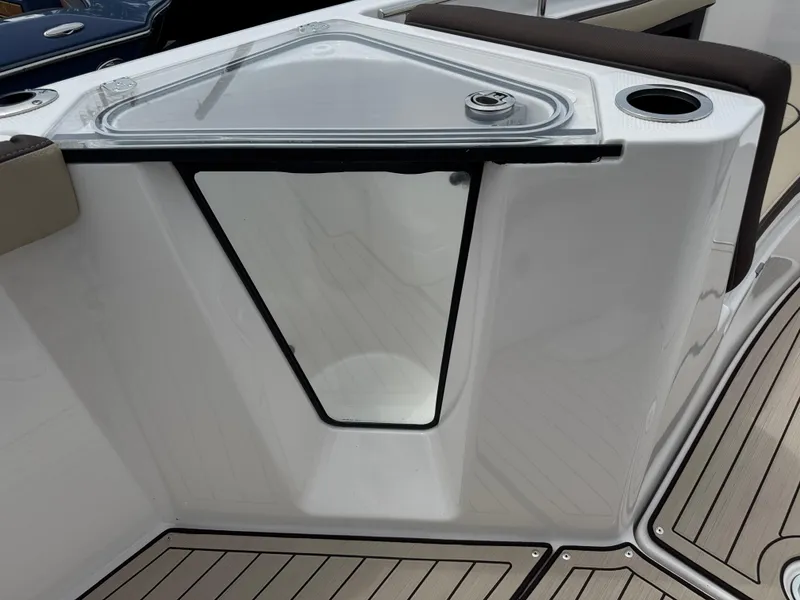 Slide: The Image of 2025 Yamaha Boats 255 FSH Sport H, featuring sleek deck design and storage compartment. - 15