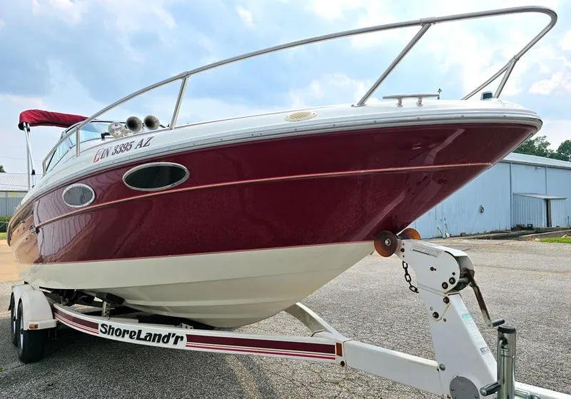 Slide: The Image of 1994 Sea Ray 220 Overnighter boat on ShoreLand'r trailer, parked outdoors. - 12