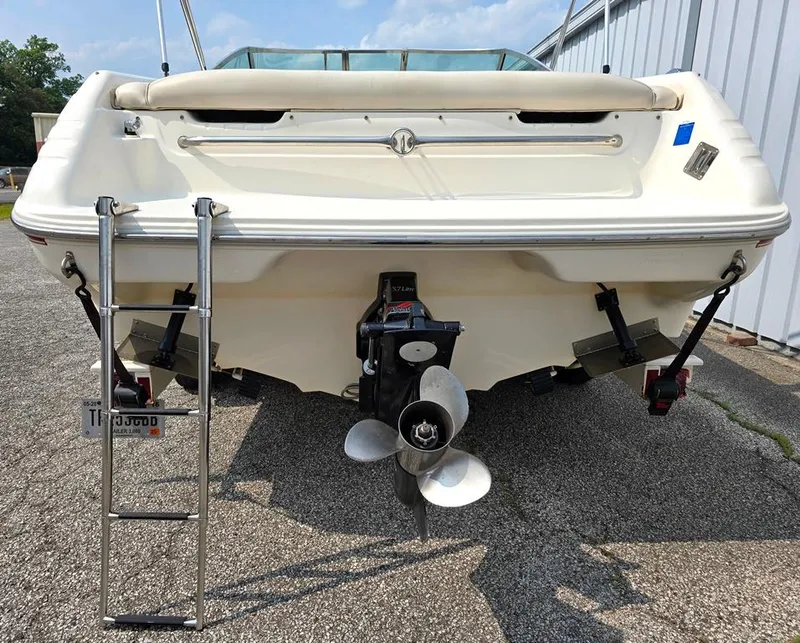 Slide: The Image of 1994 Sea Ray 220 Overnighter boat, rear view with propeller and ladder. - 13