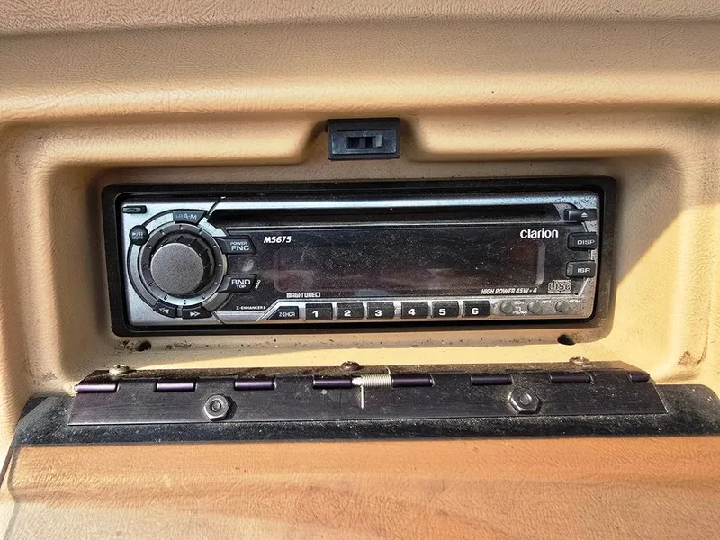 Slide: The Image of Clarion stereo system in 1994 Sea Ray 220 Overnighter boat dashboard. - 18