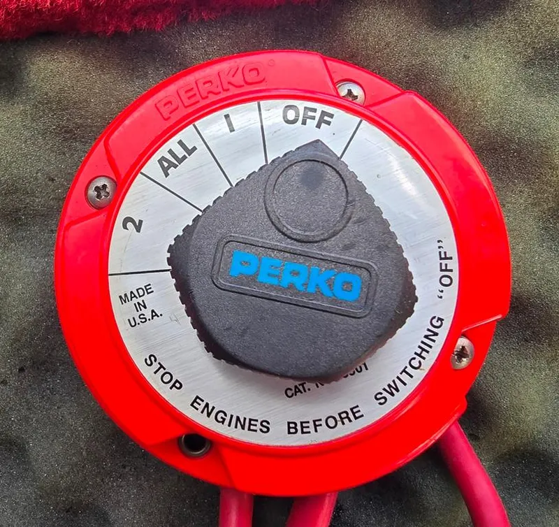 Slide: The Image of Red Perko battery switch on 1994 Sea Ray 220 Overnighter boat. - 21