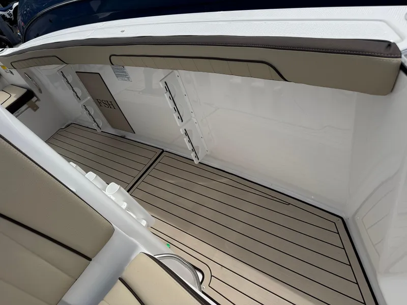 Slide: The Image of Interior view of 2025 Yamaha Boats 255 FSH Sport H, featuring sleek seating and flooring. - 16
