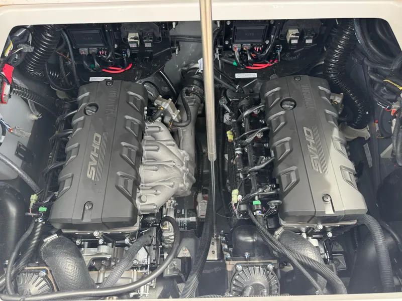 Slide: The Image of 2025 Yamaha Boats 255 FSH Sport H engine compartment with dual powerful engines. - 22