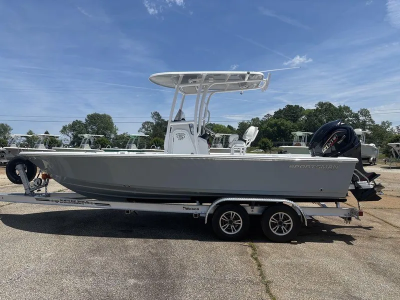 The Image of 2024 Sportsman Masters 227 Bay boat on trailer, side view, outdoors. - 1