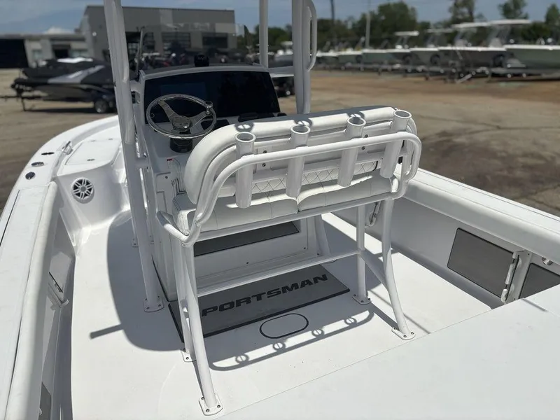 Slide: The Image of 2024 Sportsman Masters 227 Bay boat interior with steering console and seating. - 12