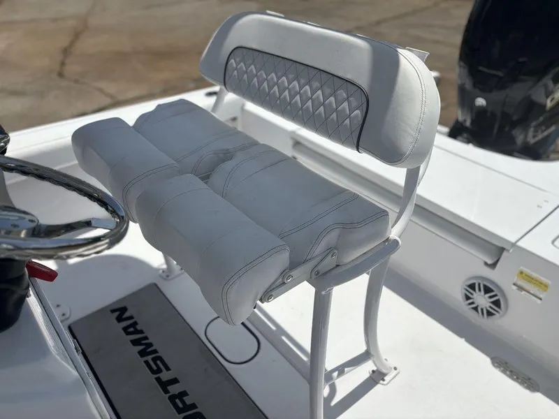 Slide: The Image of 2024 Sportsman Masters 227 Bay boat seat with diamond-patterned backrest. - 13