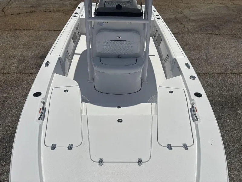 Slide: The Image of 2024 Sportsman Masters 227 Bay boat deck with seating and storage compartments. - 17