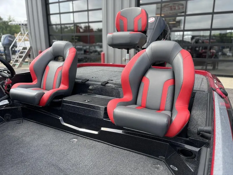 Slide: The Image of 2025 Nitro Z19 Pro boat seats, red and gray design, in a showroom setting. - 10