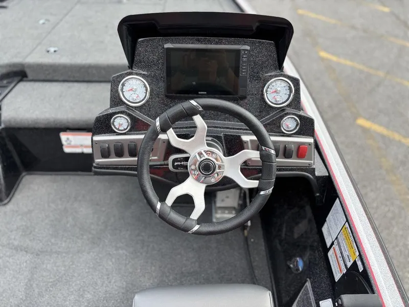 Slide: The Image of Steering console of a 2025 Nitro Z19 Pro boat with modern gauges and controls. - 11