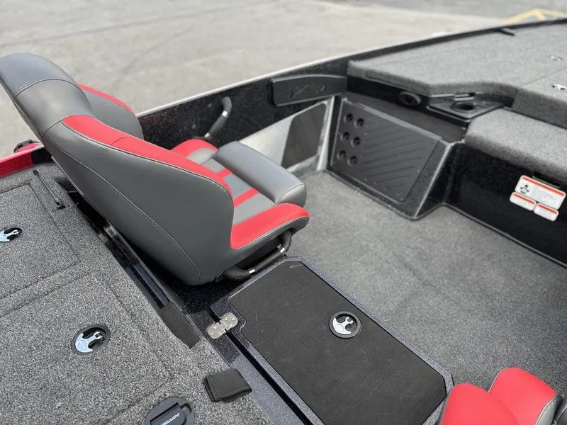 Slide: The Image of 2025 Nitro Z19 Pro boat interior with red and gray seating, showcasing modern design. - 12
