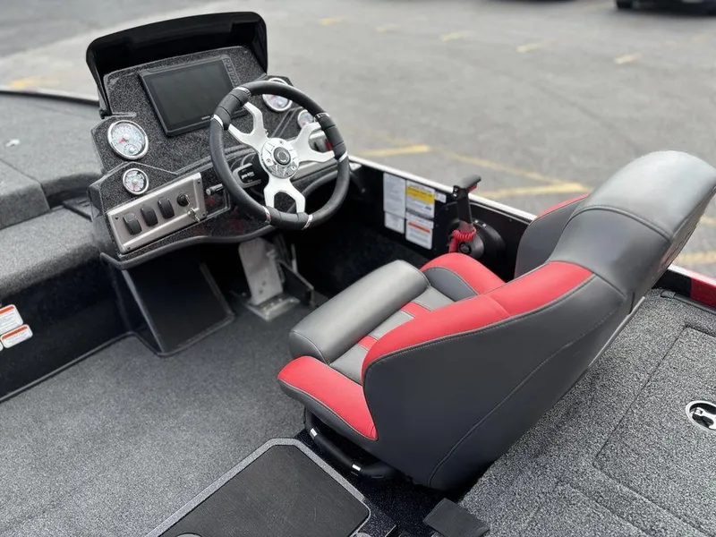 Slide: The Image of 2025 Nitro Z19 Pro boat interior with steering wheel and red-accented seat. - 16
