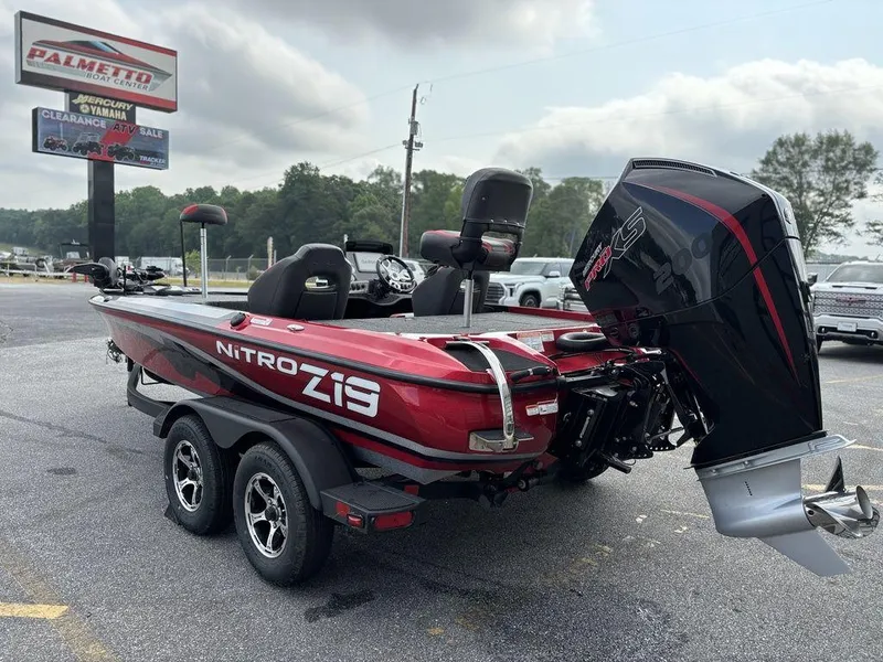 Slide: The Image of 2025 Nitro Z19 Pro boat with powerful outboard motor, parked on a trailer. - 3
